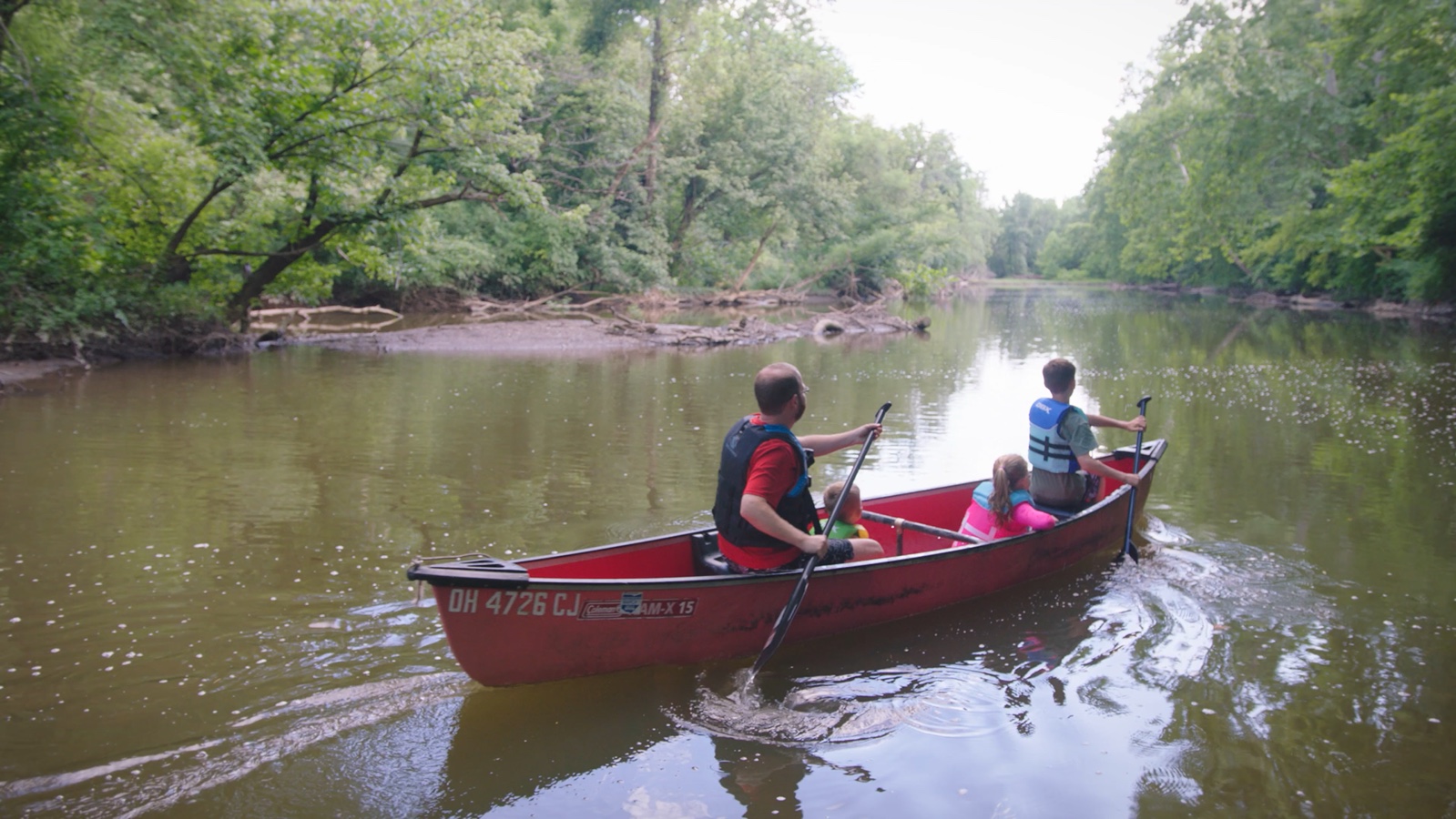 A canoe on a waterway in the City of Gahanna brand video