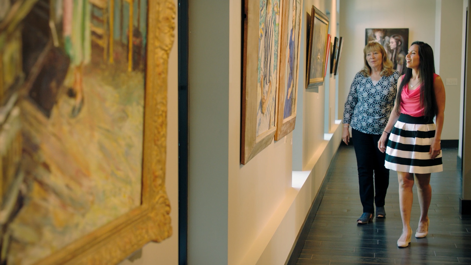 Two people exploring a gallery in the City of Gahanna brand video
