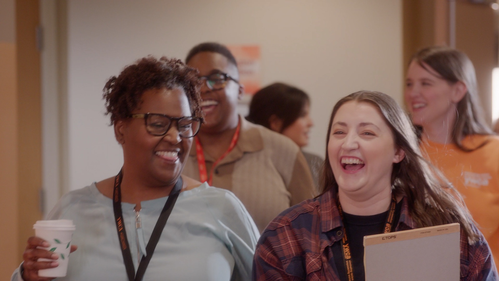 People smiling together in the YWCA Columbus anniversary video